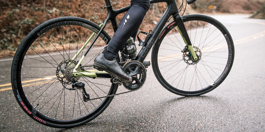the pedals and shoes of a road cyclist, while on the road