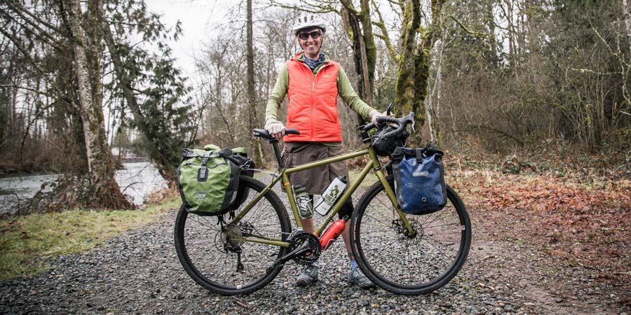 A bike with paniers and a handlebar bag