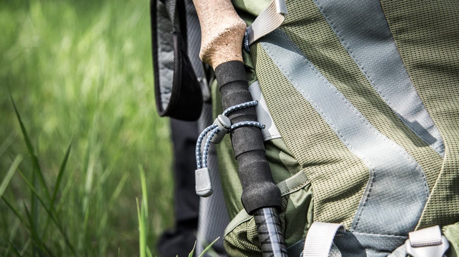 attaching trekking pole to backpack