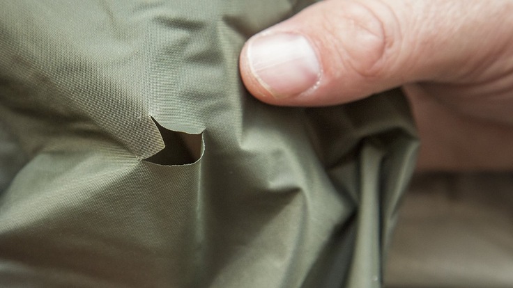 Tent with a tear in the fabric