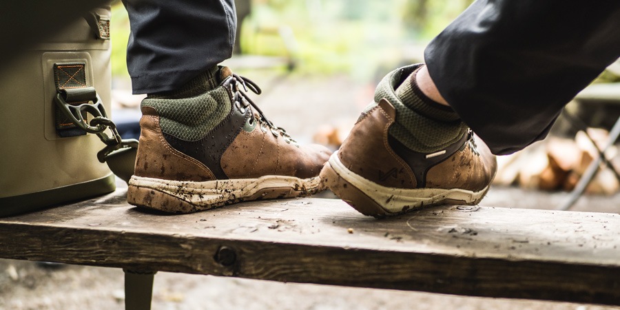 camper wearing sturdy shoes around the campsite