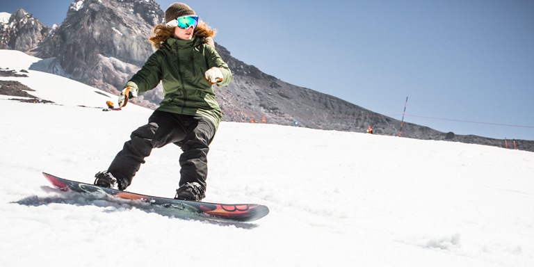 A woman snowboarding