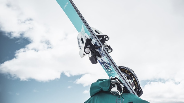 Person carrying skis