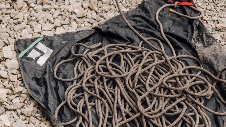 a climbing rope on a tarp
