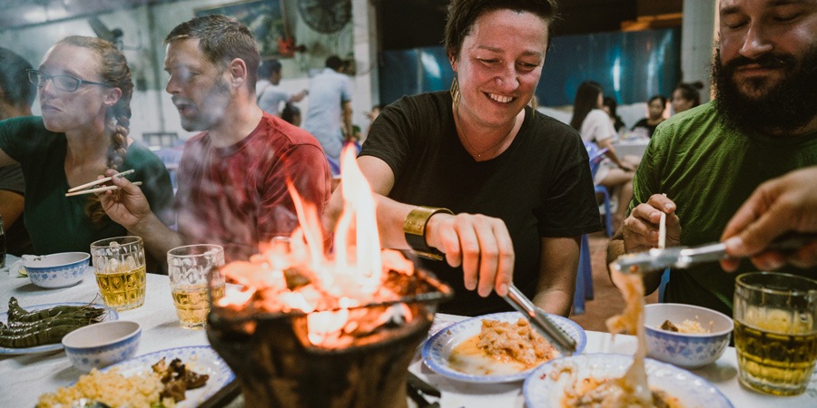 travelers enjoying a shared meal
