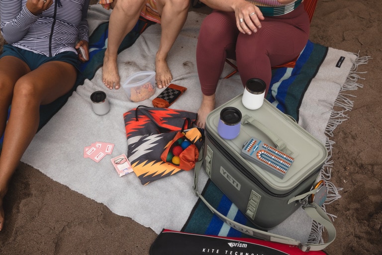 Picture of people playing cards at camp