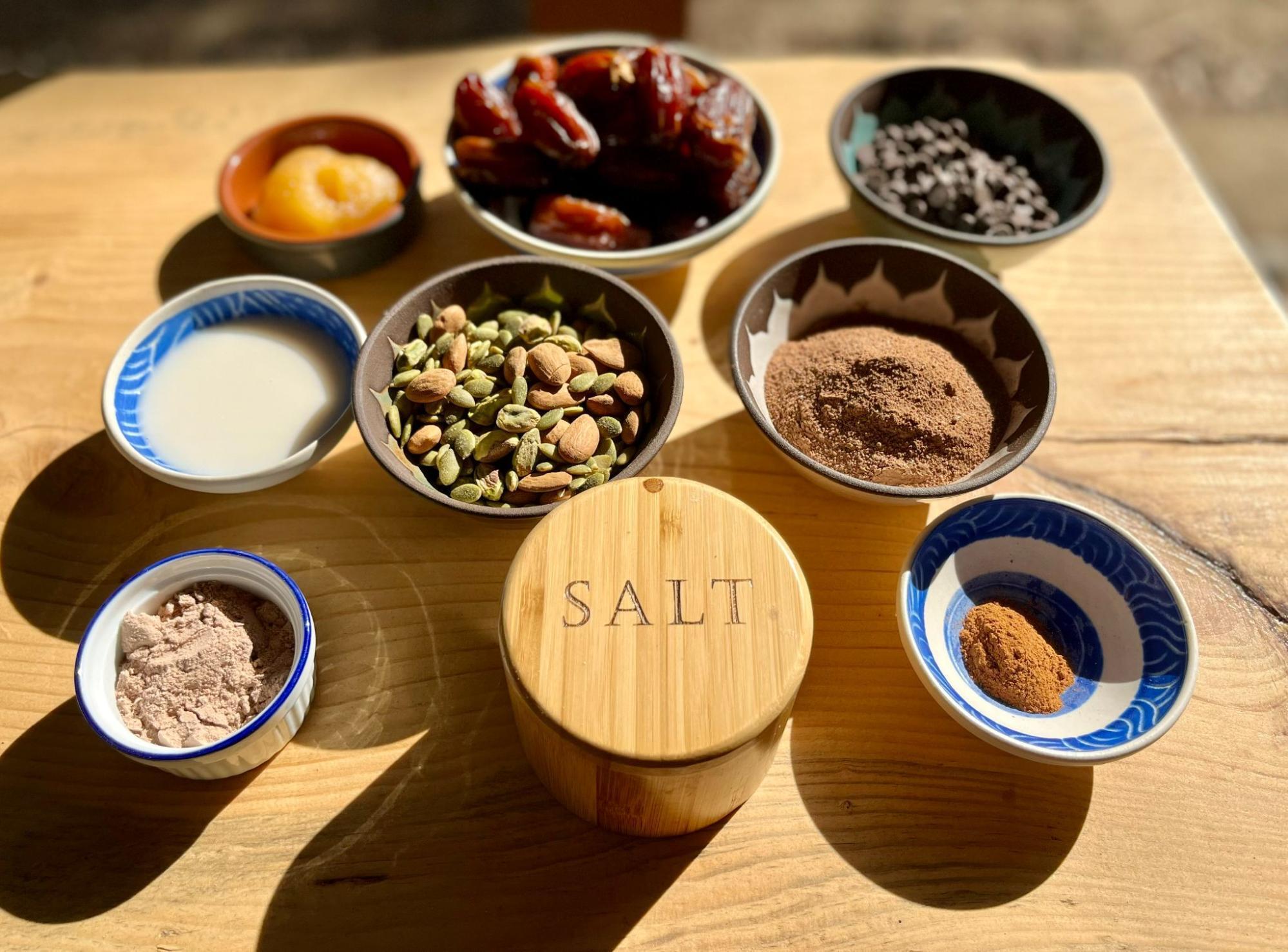 Protein bar ingredients laid out on a board.