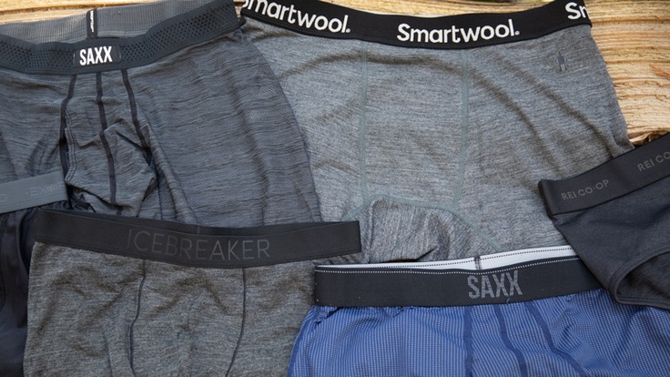 A product shot of men's underwear on a wood background.