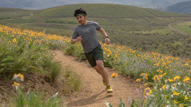 A trail runner winds their way around singletrack in the Patagonia Nine Trails Shorts.