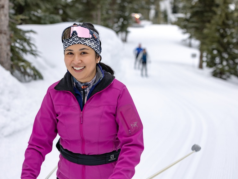 A cross-country skier wears a soft-shell jacket as an outer layer to help protect from wind and rain.