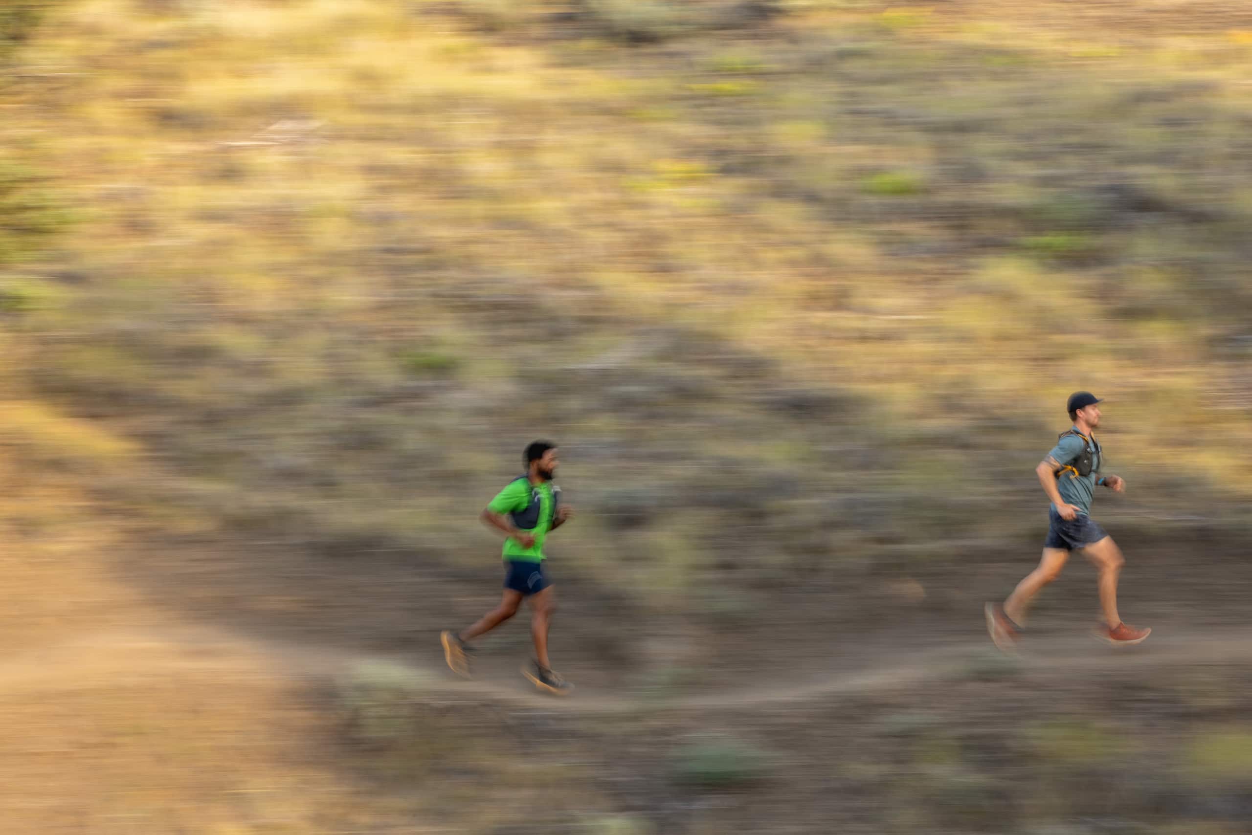 two people running along a trail
