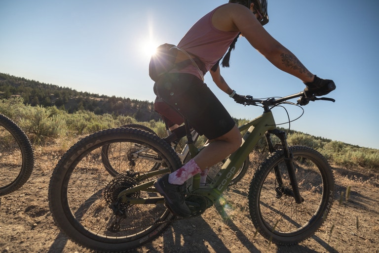 A mountain biker wears bike shorts while on a trail ride