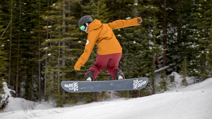 A snowboarder doing an ollie