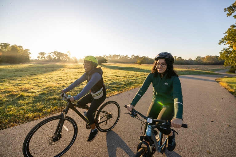 Two people on hybrid bikes