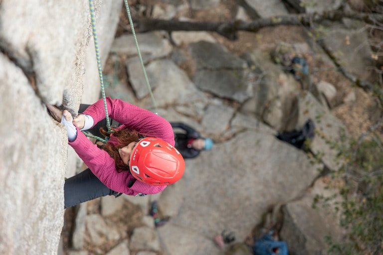 A person climbs a crack in the wall