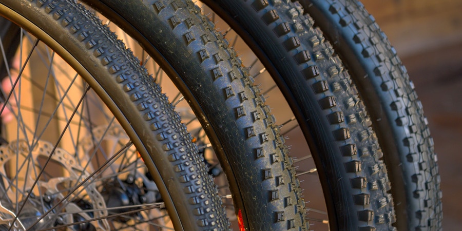 four examples of knobby treads used on mountain bike tires.