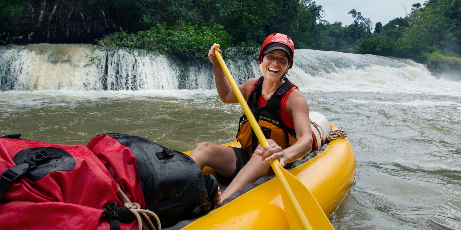 A rafter paddling in a river.