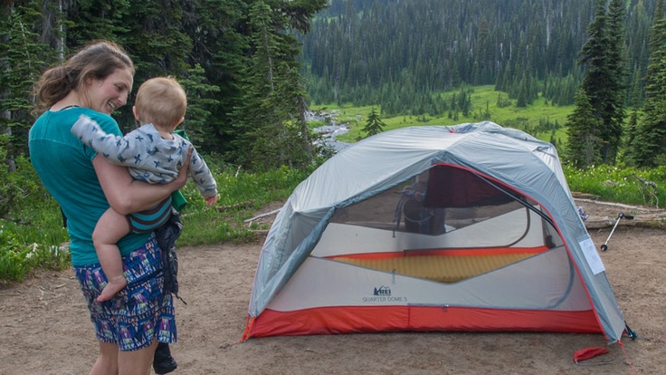 a mother and her infant son at camp
