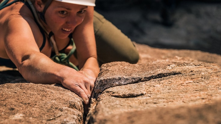girl climbing a crack