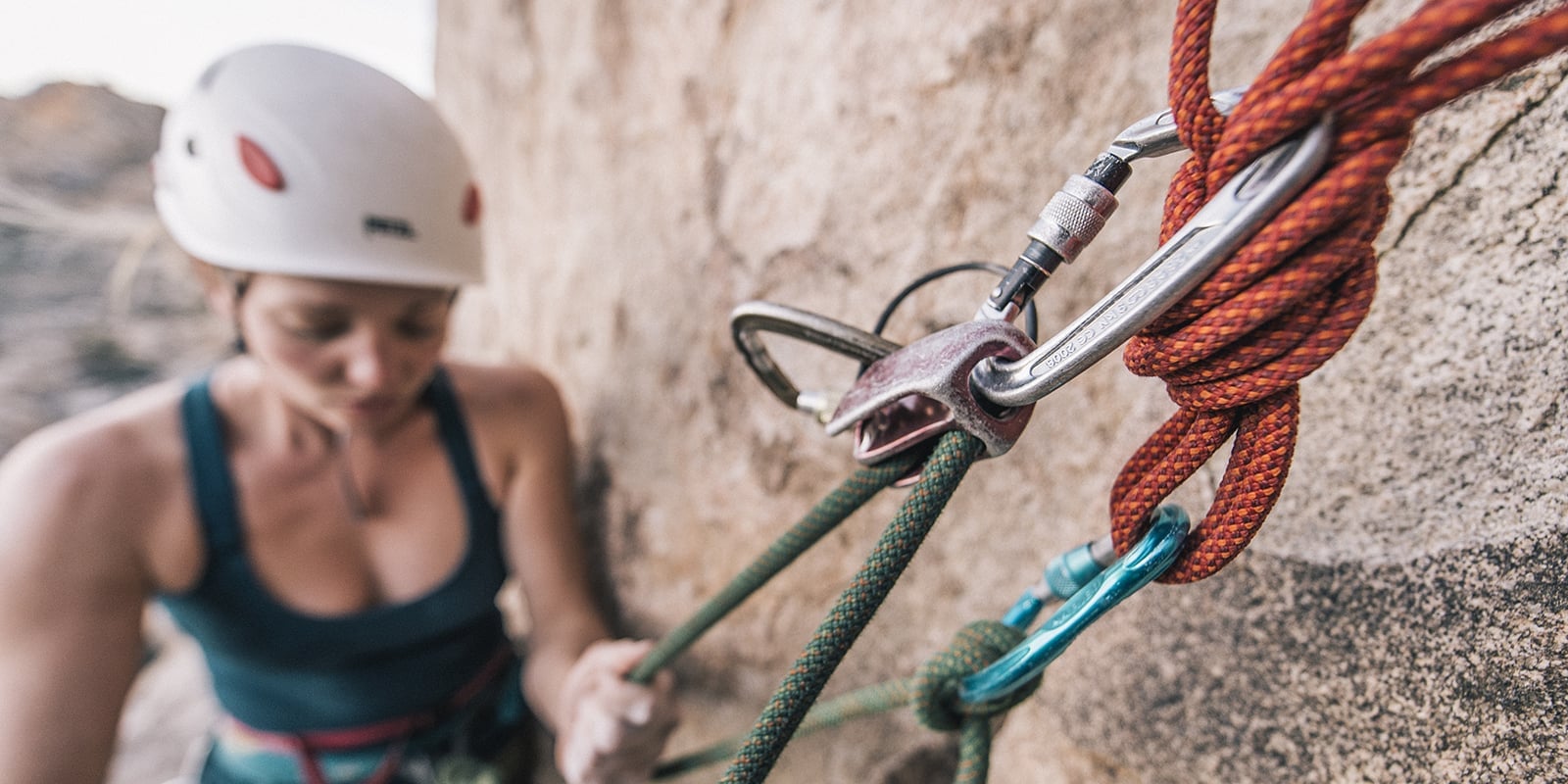  A climber roped into some protection on a rock wall