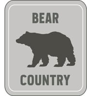 Bear country sign with a bear on it