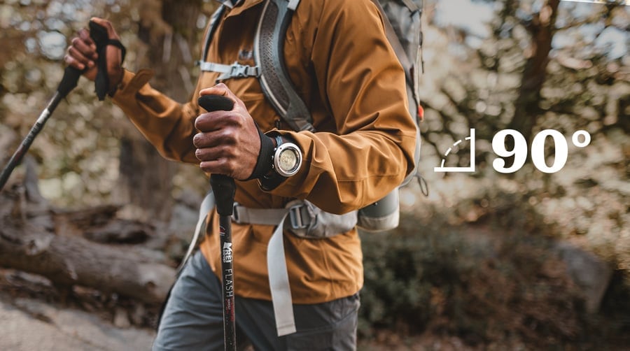 hiker demonstrating the proper elbow angle for determining the correct trekking pole length