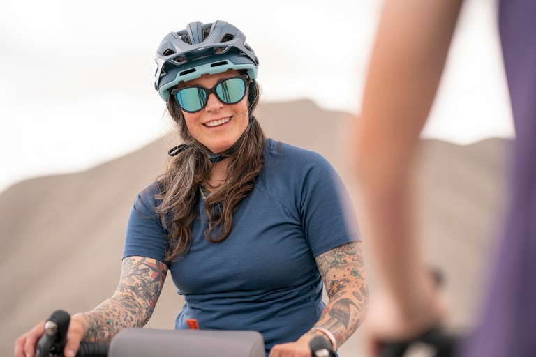 A cyclist wears sunglasses to protect against UV rays