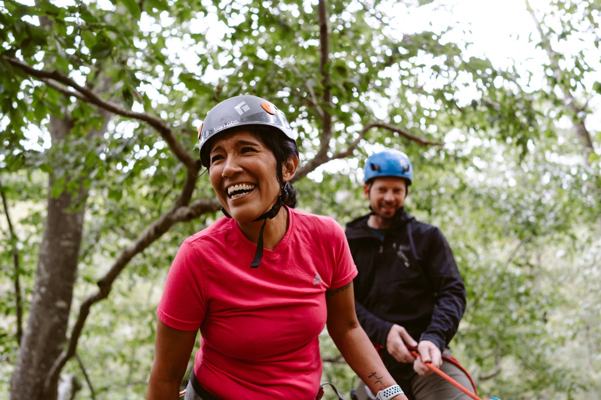 a pair of rock climbers rappelling