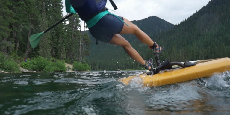 paddle boarder falling off their paddle board