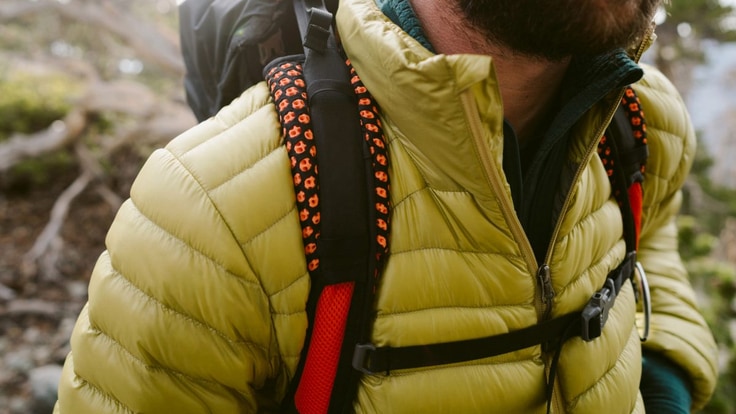 A hiker wearing a down jacket