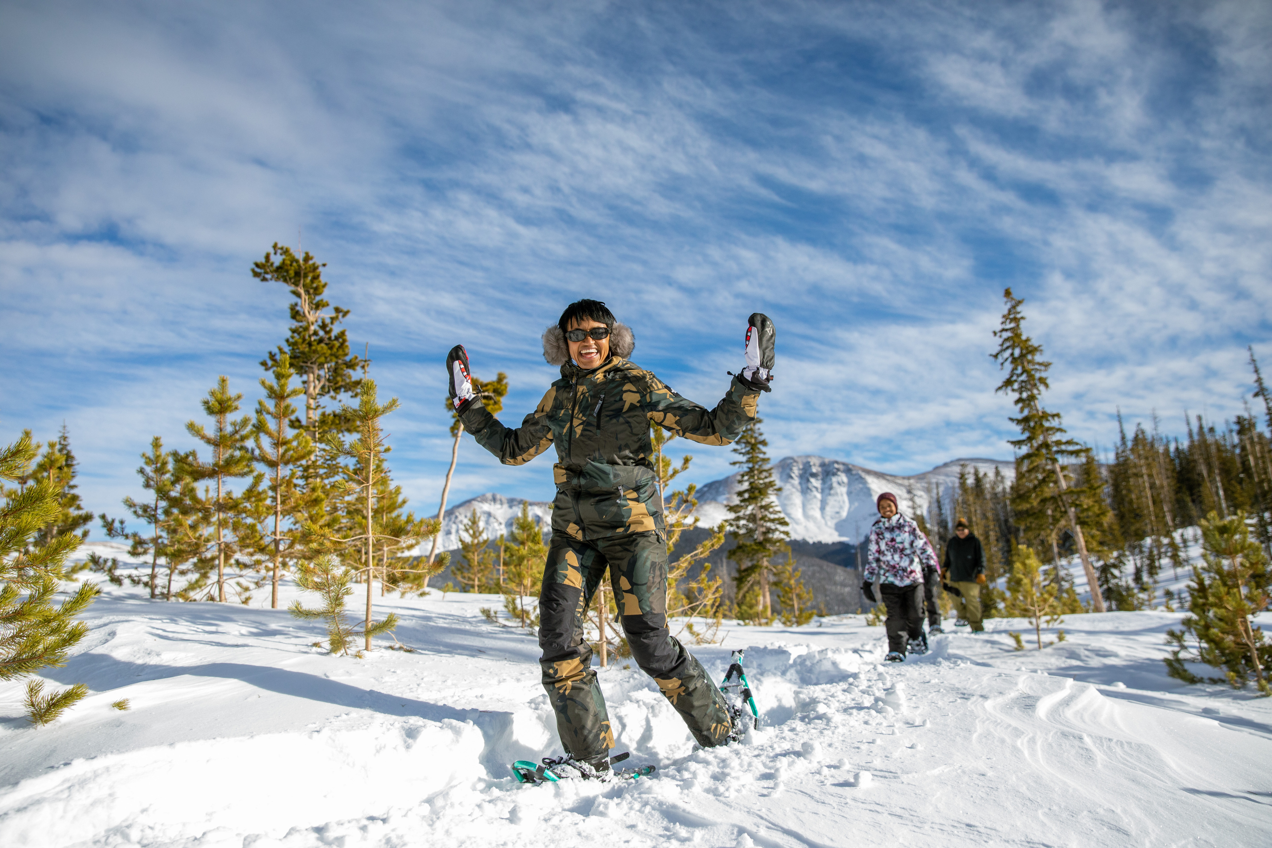 Person in snowshoes walking through snow