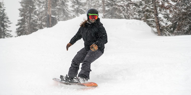 A woman snowboarding