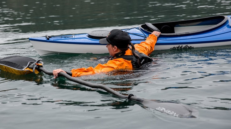 Instructor demonstrates what to do in the water