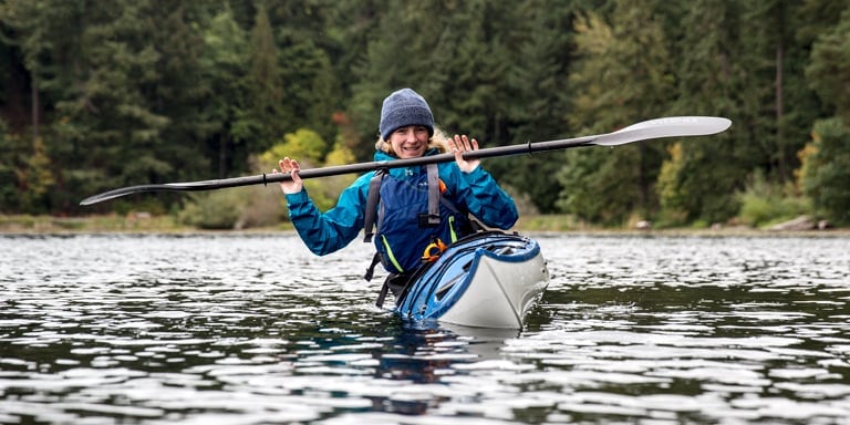 Instructor demonstrates an edging exercise in the kayak