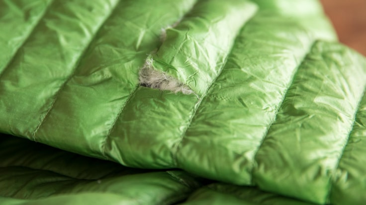 A down jacket with a hole in the sleeve
