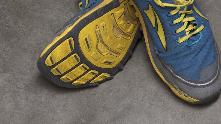 A detail shot of worn out running shoes