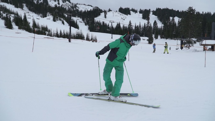 a skier doing a kick turn