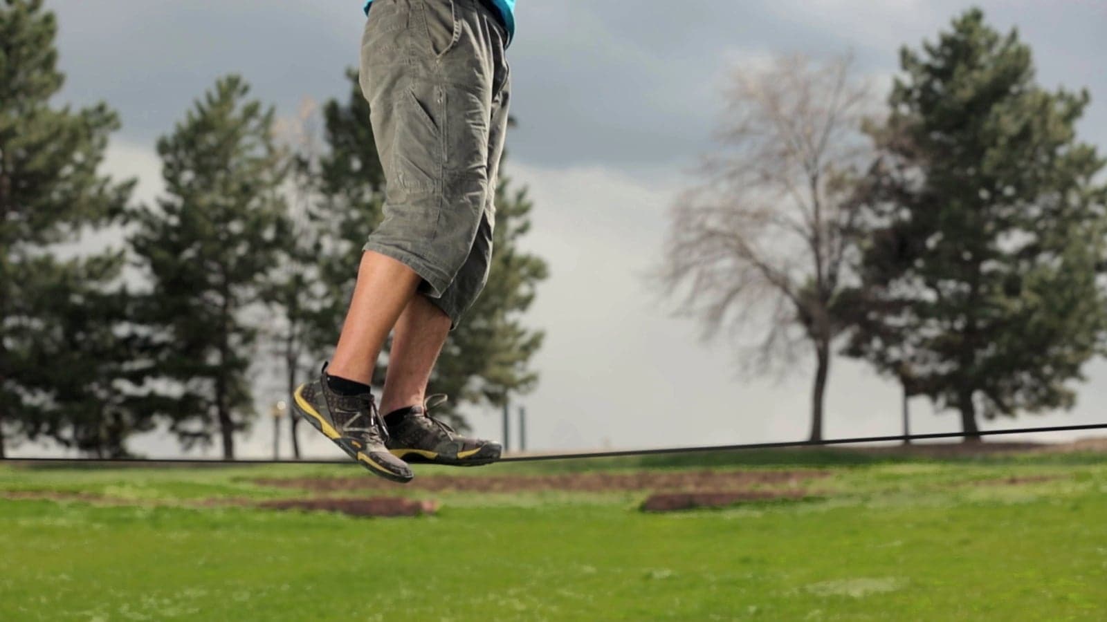 A person walking on a slackline
