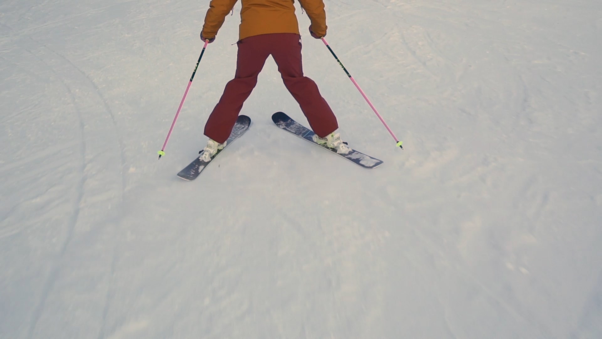 A skier steers on foot to turn