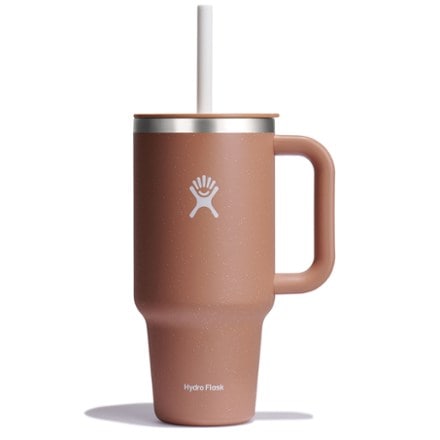A pink Hydro Flask tumbler with a handle and lid