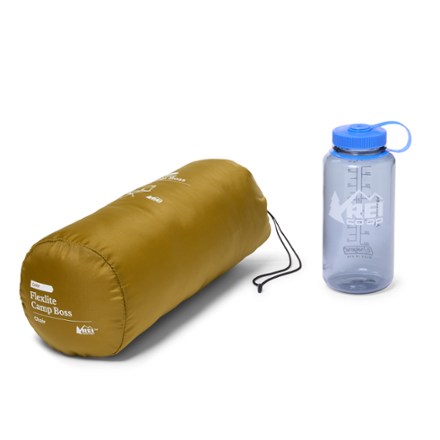 Flexlite Camp Boss packed up next to a water bottle