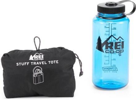 REI Co-op Stuff Travel Tote Integrated stuff sack with a 32 oz bottle for size reference (Black)