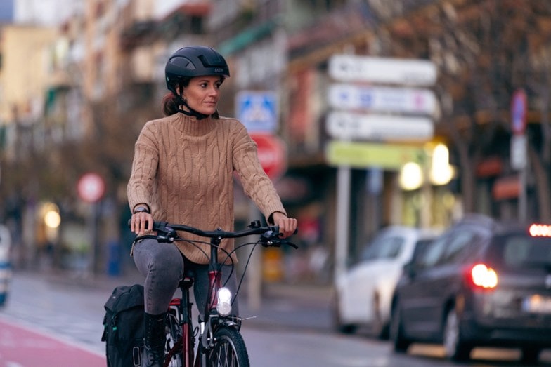 woman wearing Lazer CityZen KinetiCore electric bike helmet