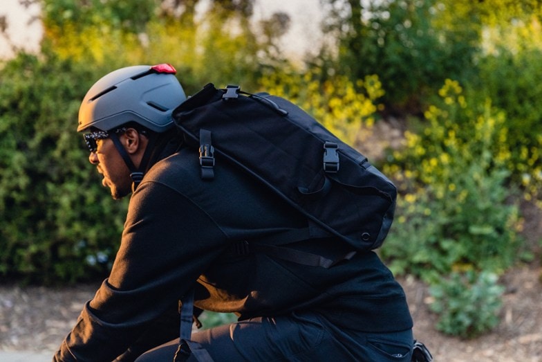 man riding bike and wearing best electric bike helmet