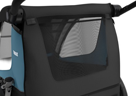 Thule Courier Dog Trailer Kit Includes roll up mesh window & rain cover and removable padded dog bed. Trailer not included.
