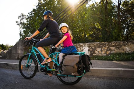 family riding on cargo bike