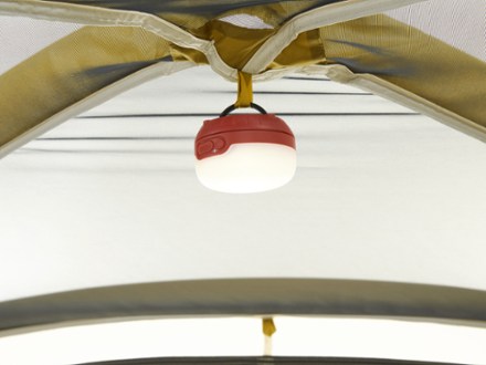REI Co-op Base Camp 4 Tent Light (not included) hung on gear loop