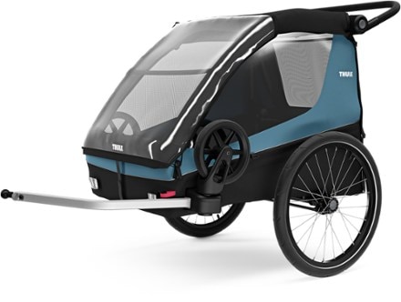Thule Courier Dog Trailer Kit Includes roll up mesh window & rain cover and removable padded dog bed. Trailer not included.