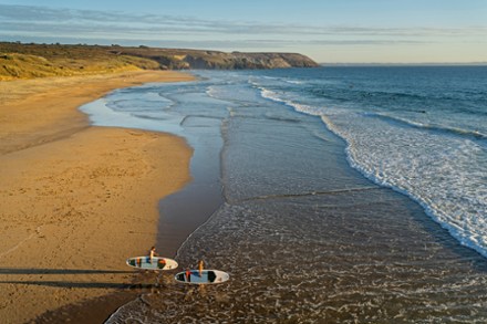 paddle boarders about to get in the water