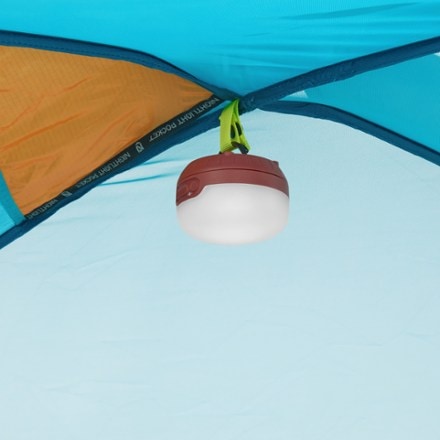 NEMO Aurora Highrise 4P Tent Light (sold separately) hung on gear loop